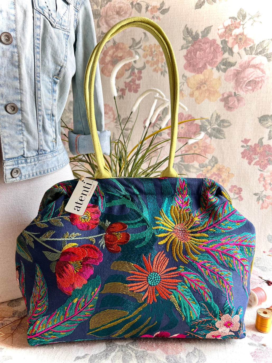Atenti Floral Molly handbag with embroidered botanical design, chartreuse handles and trim, and organized lined interior