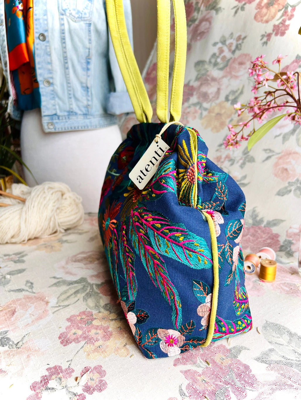 Atenti Floral Molly handbag with embroidered botanical design, chartreuse handles and trim, and organized lined interior