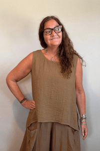 Gertie's 1050 Gail's Tank in Winter Olive, featuring a sleeveless relaxed A-line silhouette, round neckline, crinkled texture and deep side slits.