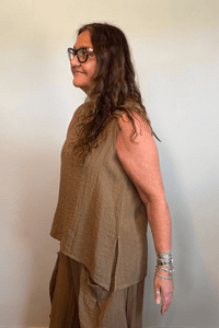 Gertie's 1050 Gail's Tank in Winter Olive, featuring a sleeveless relaxed A-line silhouette, round neckline, crinkled texture and deep side slits.