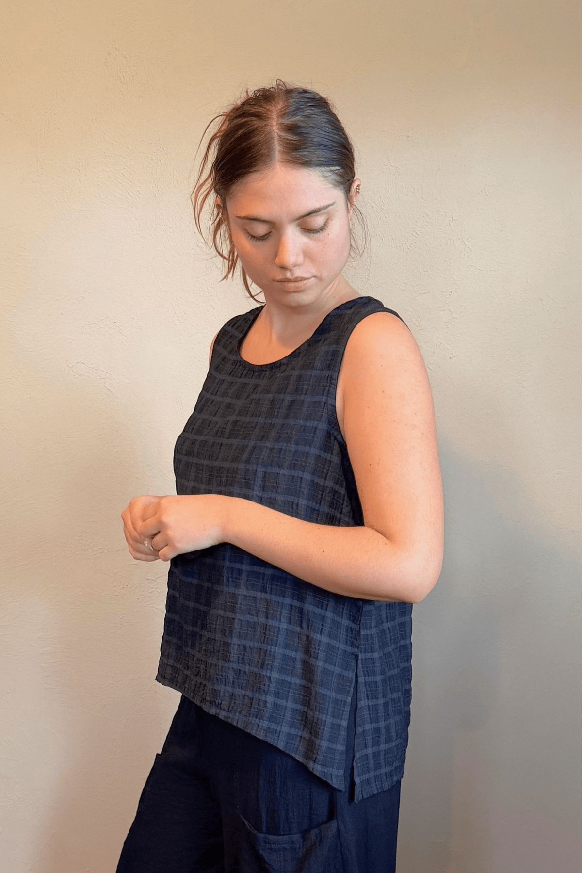 Gertie's 1052 Gail's Tank in Indigo tonal check Travel Crinkle fabric, with a sleeveless A-line silhouette, scoop neckline, and side slits.