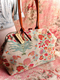 Atenti Gemma Molly handbag with vintage-inspired floral print, rust-colored double handles, spotted frame trim, and organized lined interior