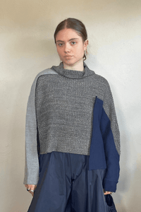 Moyuru 46332G Grey Combo pullover sweater with asymmetric grey and deep blue knit panels