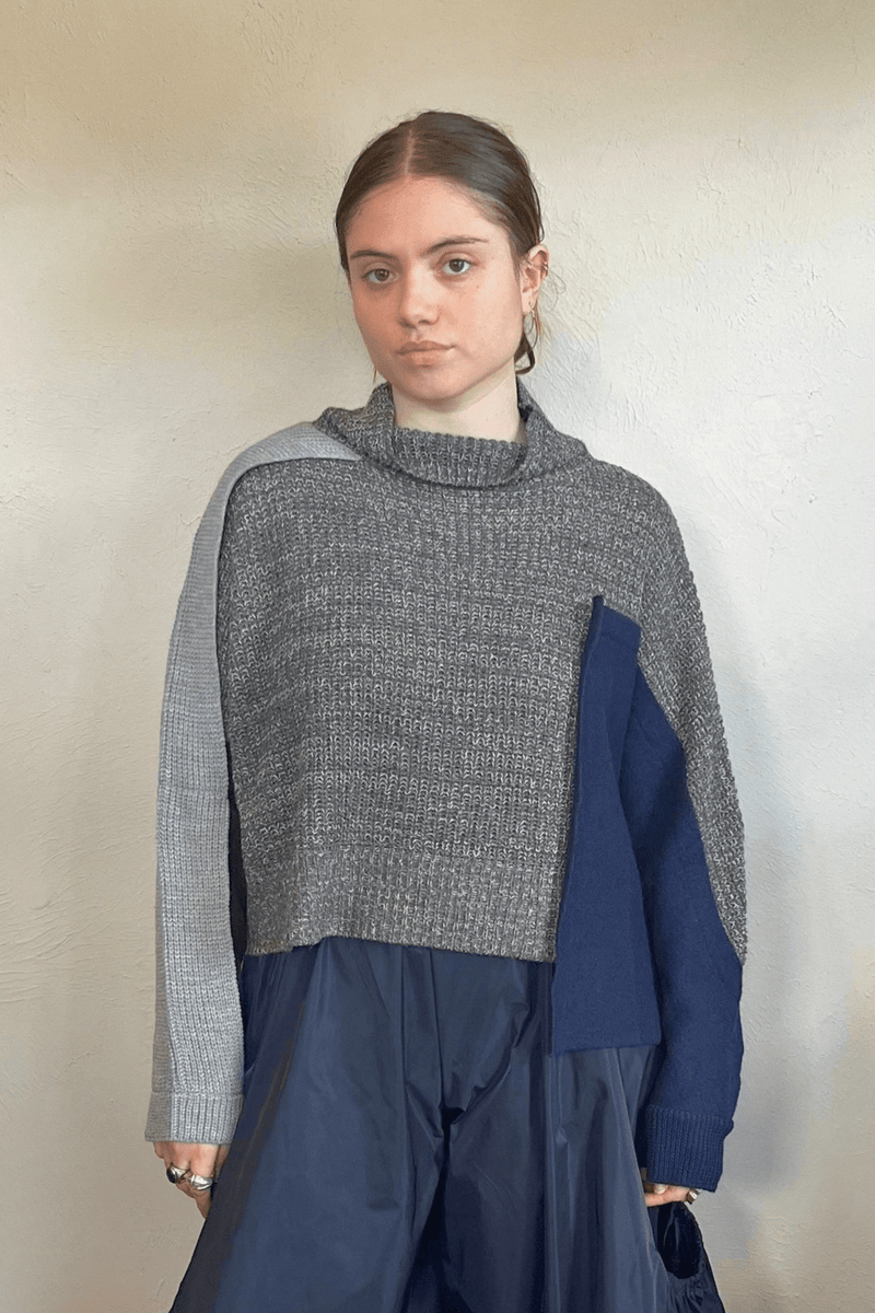 Moyuru 46332G Grey Combo pullover sweater with asymmetric grey and deep blue knit panels