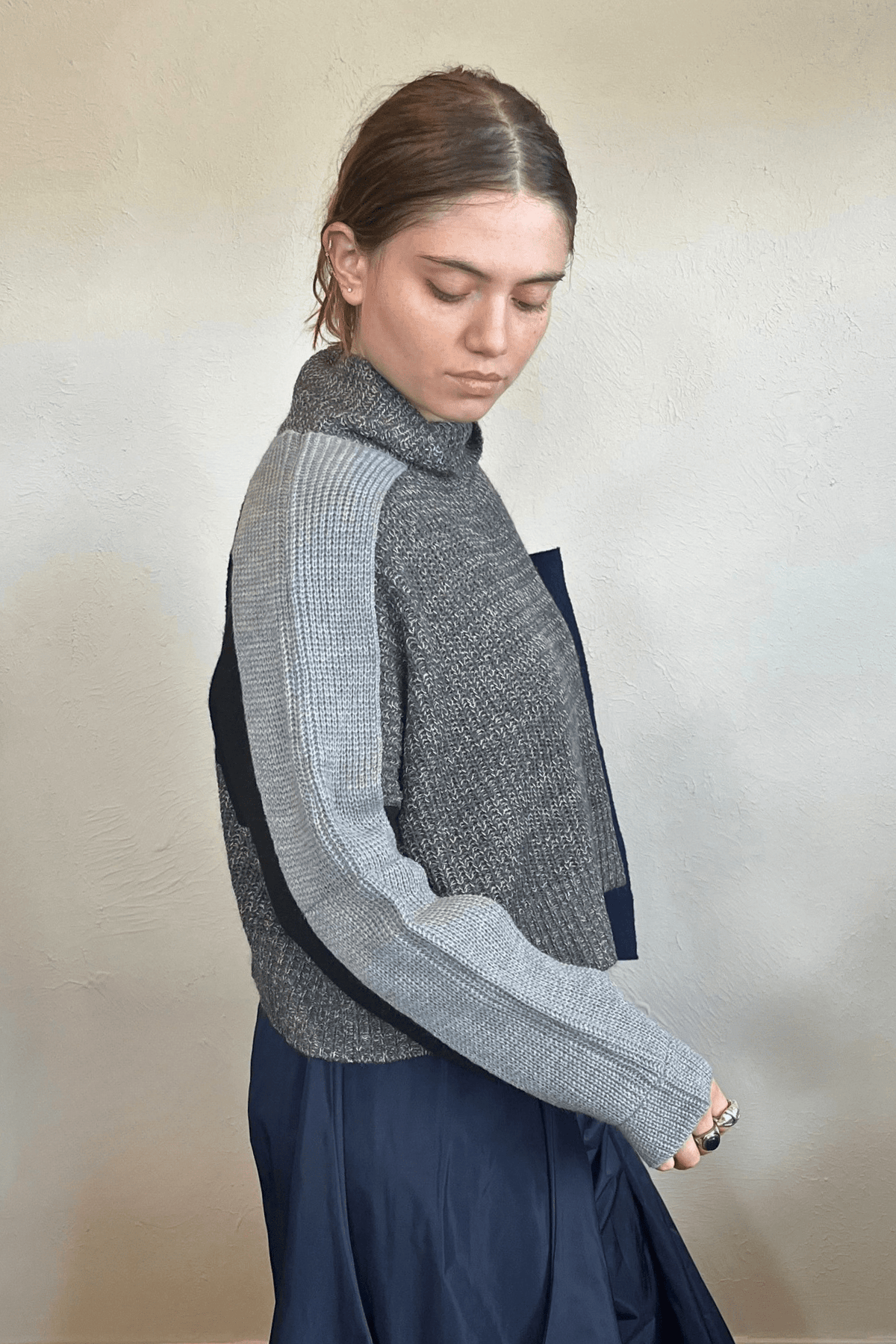 Moyuru 46332G Grey Combo pullover sweater with asymmetric grey and deep blue knit panels