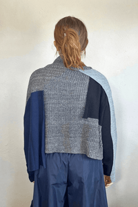 Moyuru 46332G Grey Combo pullover sweater with asymmetric grey and deep blue knit panels