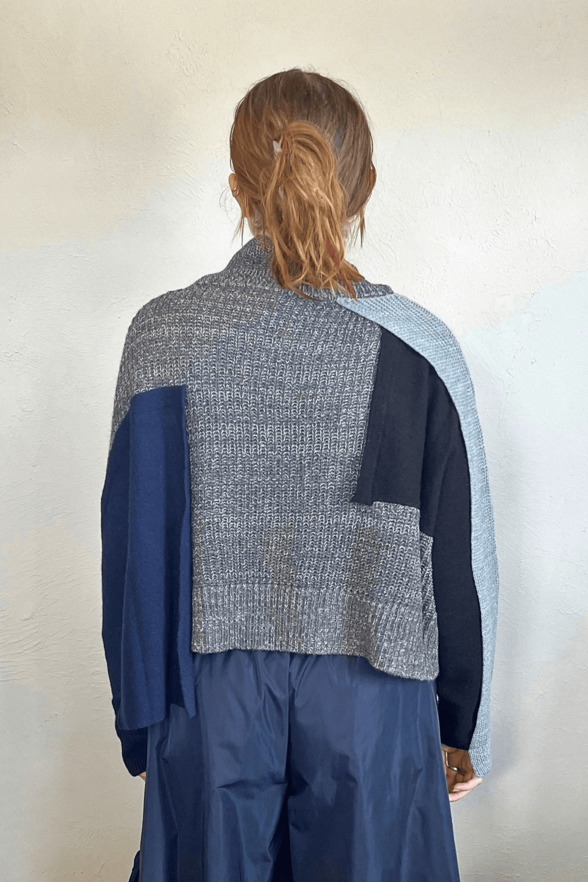 Moyuru 46332G Grey Combo pullover sweater with asymmetric grey and deep blue knit panels