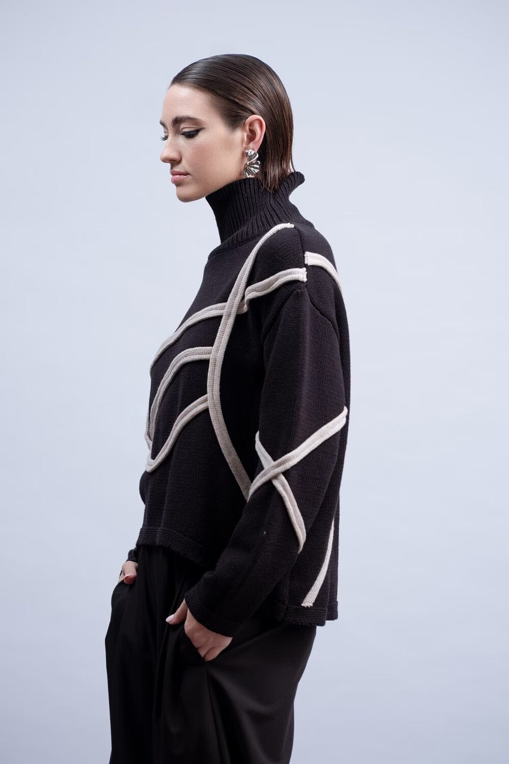 Haako H2032 black turtleneck sweater with raised light contrast looping knit trim