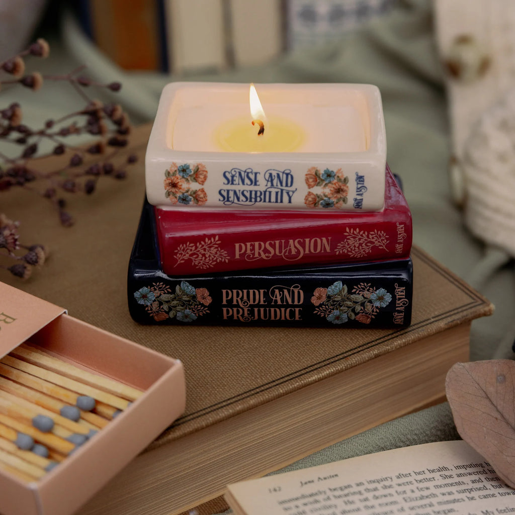 Steel Mill & Co. Jane Austen Bookstack Candle featuring Sense and Sensibility, Persuasion, and Pride and Prejudice in a ceramic book stack