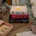 Steel Mill & Co. Jane Austen Bookstack Candle featuring Sense and Sensibility, Persuasion, and Pride and Prejudice in a ceramic book stack
