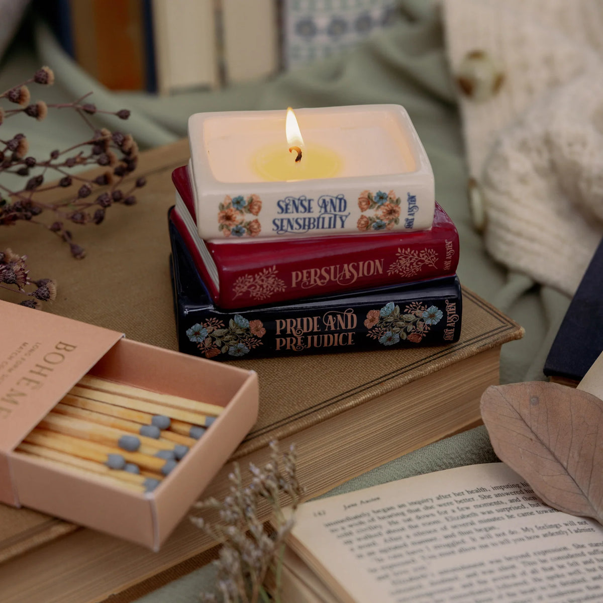 Steel Mill & Co. Jane Austen Bookstack Candle featuring Sense and Sensibility, Persuasion, and Pride and Prejudice in a ceramic book stack