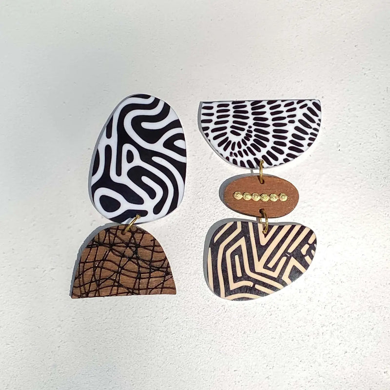 Black And White Nexus Earrings by xoxo,bijou with abstract patterns and natural wood tones