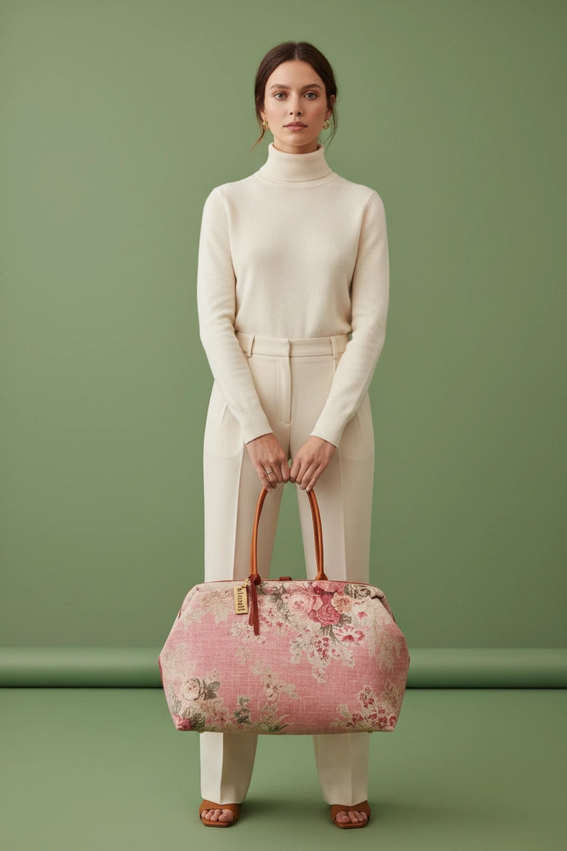 Atenti Rosewood Pioneer handbag with faded rose print, caramel double handles and piping, and contrasting caramel base with metal feet