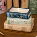Steel Mill & Co. Ladies of Literature Stacked Books Candle featuring Jane Eyre, Anne of Green Gables, and Mansfield Park