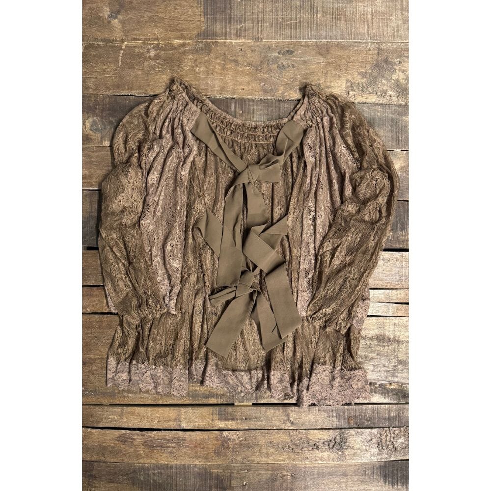 Brown sheer floral lace coverlet with long gathered sleeves and multiple ribbon ties, shown flat on a rustic wood background.